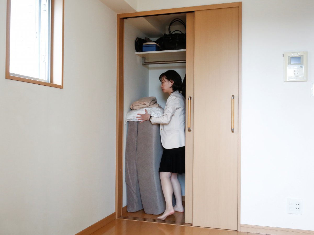 minimalist saeko kushibiki stores away her futon mattress in her apartment out of sight out of mind